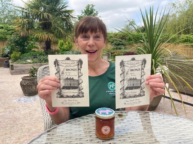 Chrissie holding her two World Marmalade bronze medals